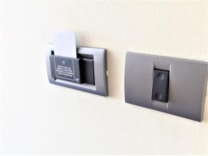 a electrical outlet on a wall with a box at Hotel Central Slavonski Brod in Slavonski Brod