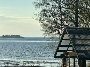 a view of a body of water with a house at Merenranta Huvila 210 m2 in Kokkola