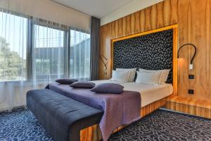 Säng eller sängar i ett rum på Palanga Life Balance SPA Hotel