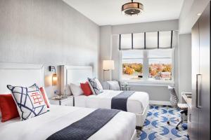 a hotel room with two beds and a window at The Bristol Hotel in Bristol +26 photos