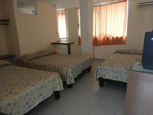 Krevet ili kreveti u jedinici u okviru objekta HOTEL PARAISO ACAPULCO