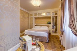 Postel nebo postele na pokoji v ubytování Hotel Ai Reali - Small Luxury Hotels of the World