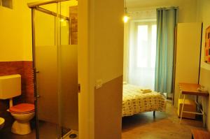 a room with a bedroom with a bed and a window at Il Moscondoro di MZ in Bologna +11 photos