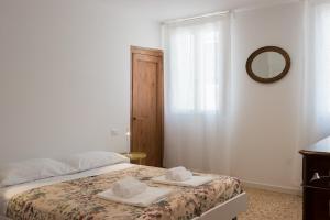 Posteľ alebo postele v izbe v ubytovaní Ca' Dandolo, affaccio sul canale