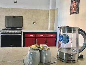 a kitchen with a blender on a counter at Hotel Y Suites Axolotl in Chignahuapan