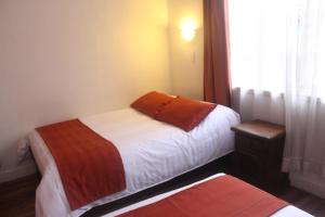 Letto o letti in una camera di Hotel Andino