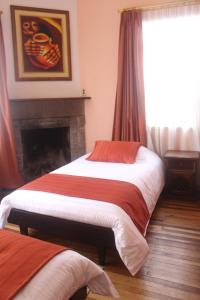 Letto o letti in una camera di Hotel Andino