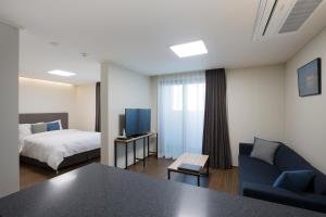 Postelja oz. postelje v sobi nastanitve New Songtan Hotel