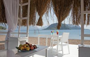 a bowl of fruit on a table on the beach at Marti Resort Deluxe Hotel in Marmaris +127 photos