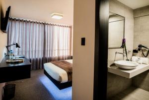 Postel nebo postele na pokoji v ubytování Hotel Viza