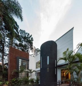 a house clad in black and white at Foresta Hotel in Medellín
