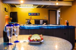 a table with a plate of food on top of it at Sea Star Apartments in Airlie Beach