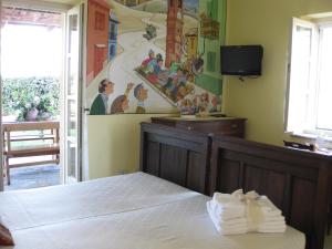 A bed or beds in a room at Agriturismo Cascina Ponchietta