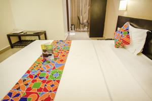 Voodi või voodid majutusasutuse Hotel Sunshine toas