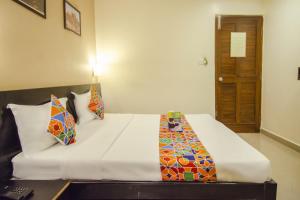 Voodi või voodid majutusasutuse Hotel Sunshine toas