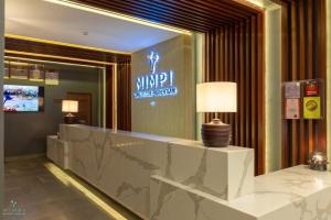 a lobby of a hotel with a reception desk at Mimpi Perhentian in Perhentian Island