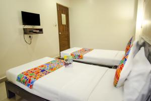 Voodi või voodid majutusasutuse Hotel Sunshine toas