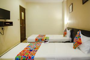 Voodi või voodid majutusasutuse Hotel Sunshine toas