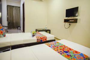 Voodi või voodid majutusasutuse Hotel Sunshine toas