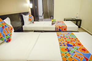 Voodi või voodid majutusasutuse Hotel Sunshine toas