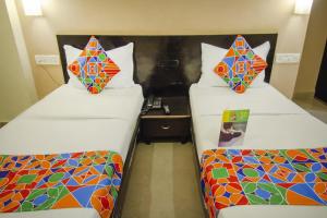 Voodi või voodid majutusasutuse Hotel Sunshine toas