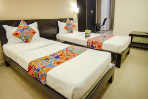 Voodi või voodid majutusasutuse Hotel Sunshine toas