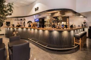 a bar in a restaurant with a shiny metal counter at Best Western Hotel City Gavle in Gävle +110 photos
