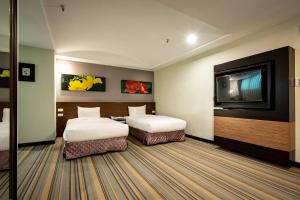 Postel nebo postele na pokoji v ubytování Yoyo Hotel