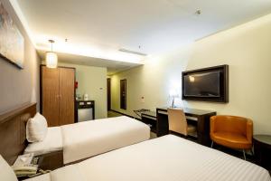 Postel nebo postele na pokoji v ubytování Yoyo Hotel