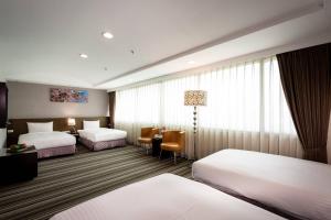 Postel nebo postele na pokoji v ubytování Yoyo Hotel