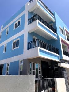 a blue building with balconies on it at CORAL SEA in Taitung City