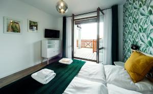 Krevet ili kreveti u jedinici u objektu Apartamenty Sun Seasons 24 - Żeromskiego