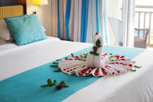 Ένα ή περισσότερα κρεβάτια σε δωμάτιο στο Pearle Beach Resort & Spa