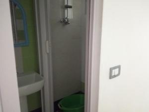 a bathroom with a shower and a toilet and a sink at immeuble selma 3 in Hammamet