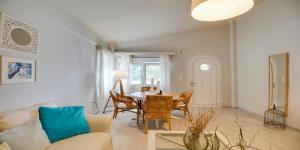a living room with a couch and a table at Ekatis Houses in Sani in Sani Beach