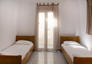 Postel nebo postele na pokoji v ubytování Villa Georgia