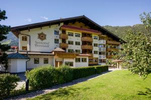 a view of the sun mountain hotel from the park at Ferienhotel Sonnenhof in Zell am Ziller