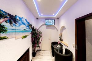 TV a/nebo společenská místnost v ubytování Hotel Stern