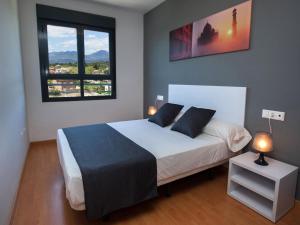 Posteľ alebo postele v izbe v ubytovaní For a Stay Las Dunas