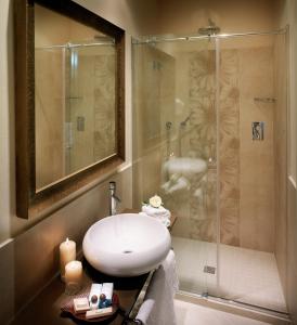 a bathroom with a sink and a shower at Hotel Life in Rimini