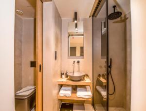 a bathroom with a sink and a shower at Portou House in Chania Town +20 photos