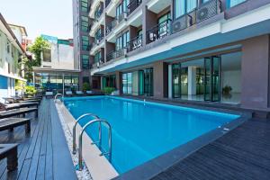 a swimming pool in the middle of a building at Vogue Pattaya Hotel in Pattaya