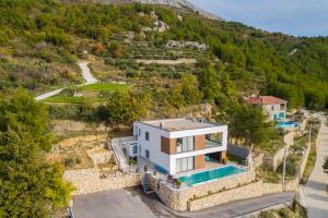 an aerial view of a house on a mountain at Royal Villa 2 in Podstrana