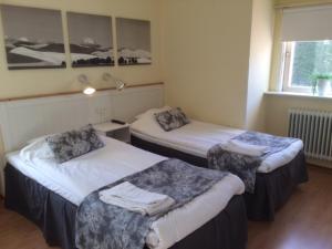 Voodi või voodid majutusasutuse Hotell Paradis toas