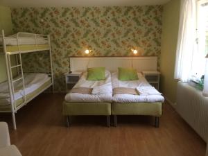 Postel nebo postele na pokoji v ubytování Hotell Paradis