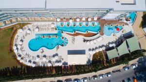 an aerial view of a resort with a pool at Asterias Beach Hotel in Ayia Napa