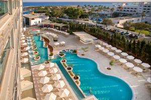an aerial view of a pool at a resort at Asterias Beach Hotel in Ayia Napa
