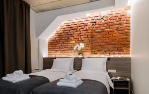 Postel nebo postele na pokoji v ubytování Dangė Hotel