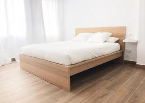 Кровать или кровати в номере Apartamentos La Gloria