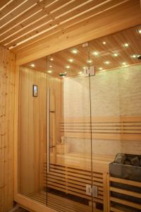 a sauna with a glass shower in a room at Dimora Molise in Vinchiaturo
